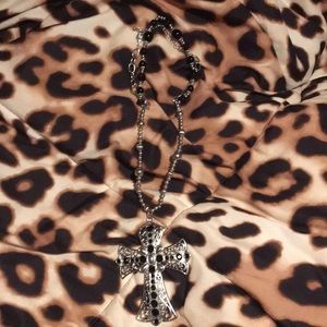 A cross necklace.